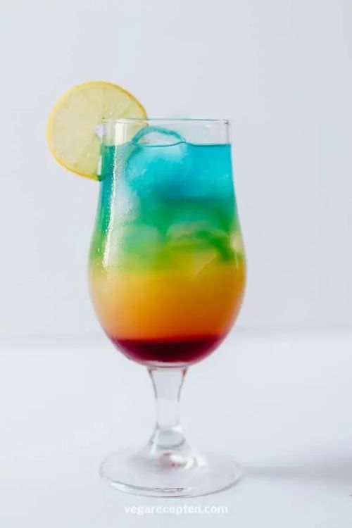 Rainbow Paradise Cocktail With Blue Curacao