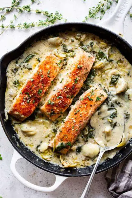 One Skillet Salmon with Creamy Spinach Artichoke Sauce